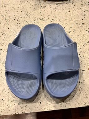 OOFOS Slide Sandals in Light Blue